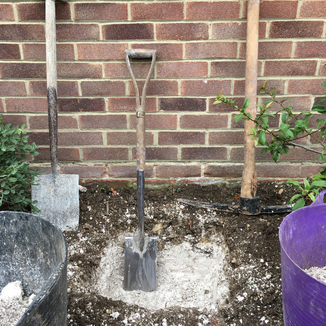 Curb Appeal digging holes for plants
