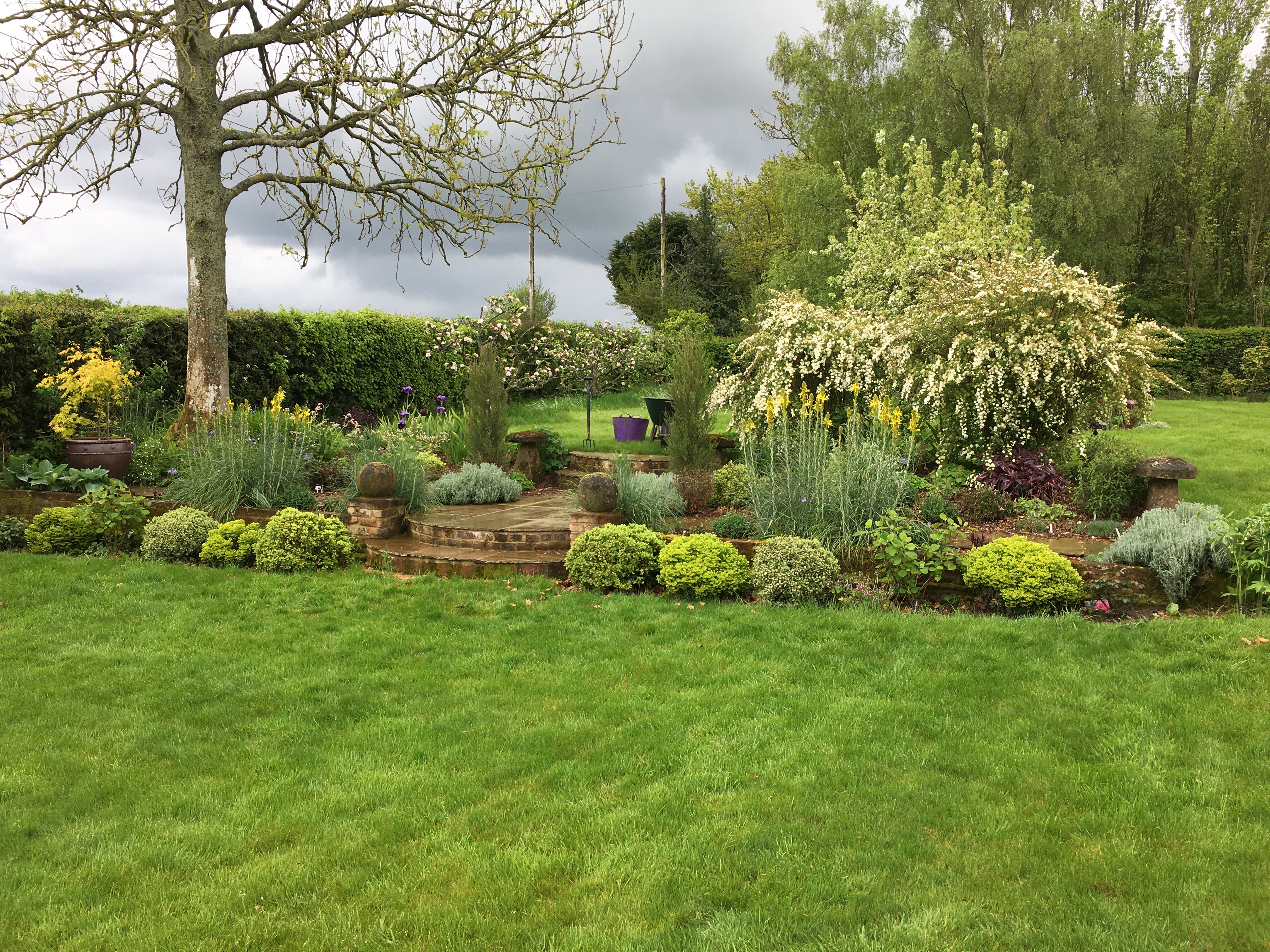Stone Staddles fully planted and blooming